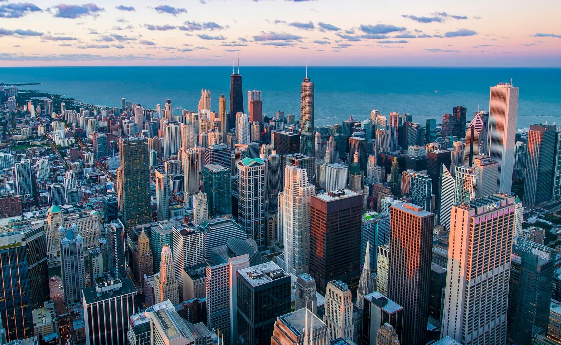 City architecture overlooking a lake at dusk